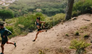 Couple of runners on mountain trail