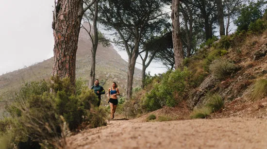 Couple of runners working out in beautiful nature